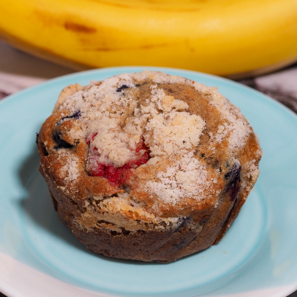 Breakfast muffin on a blue and white dessert plate